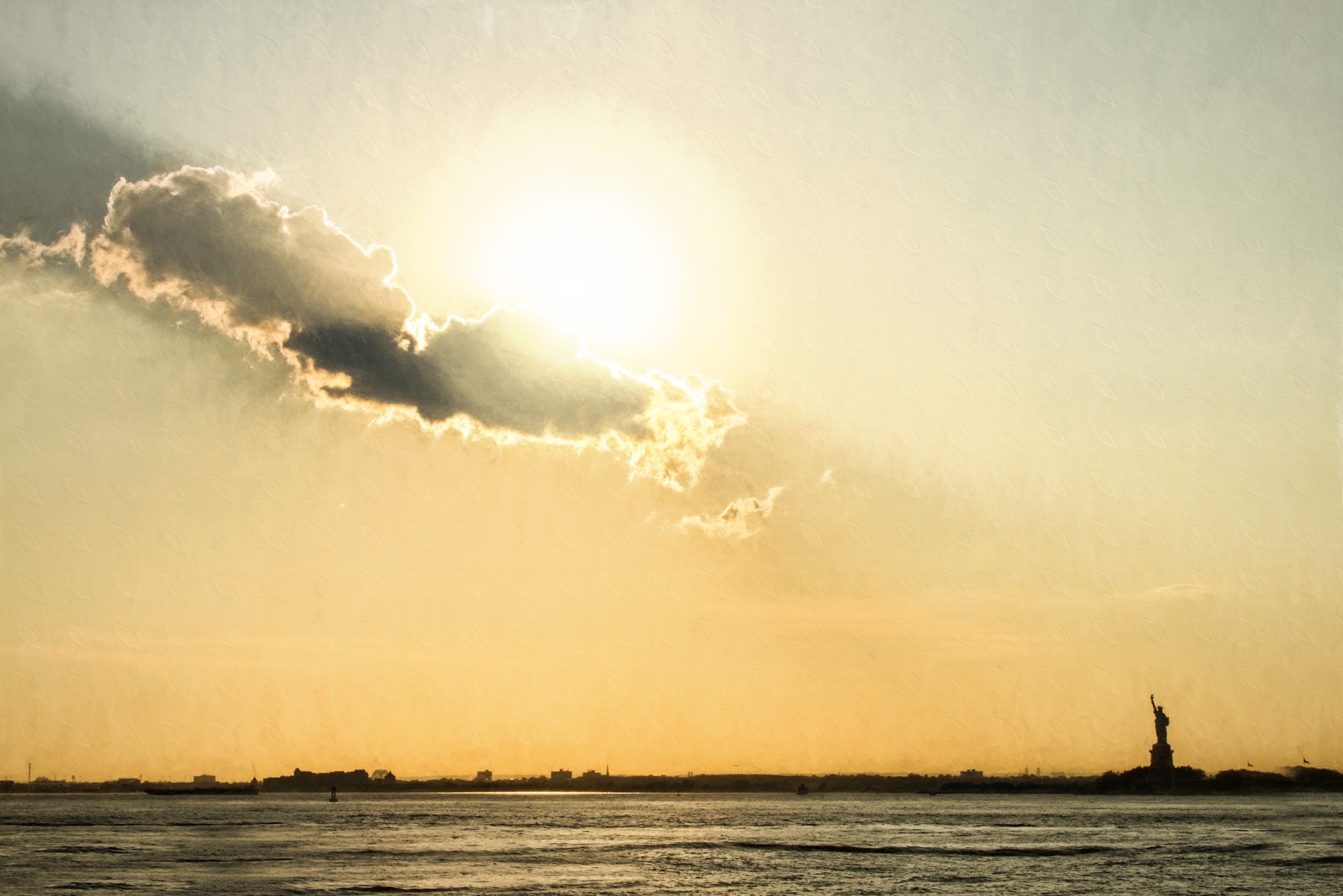 The Statue of Liberty in New York Harbor as shot from Red Hook, Brooklyn