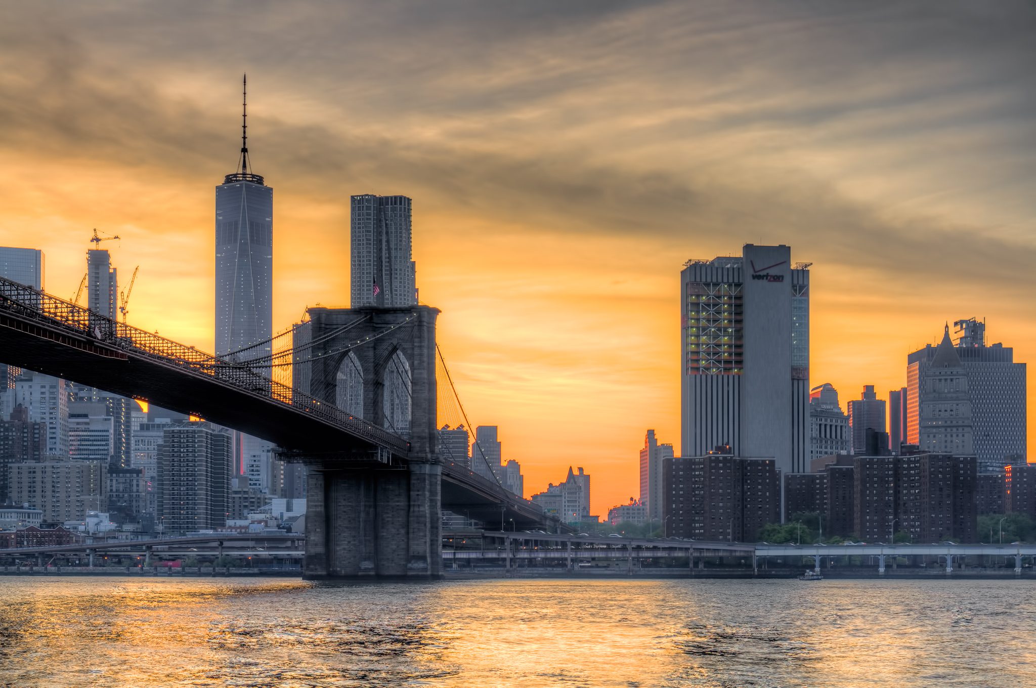 The Manhattan side of the Brooklyn Bridge, together with One World Trade Center and other Manhattan skyscrapers.
